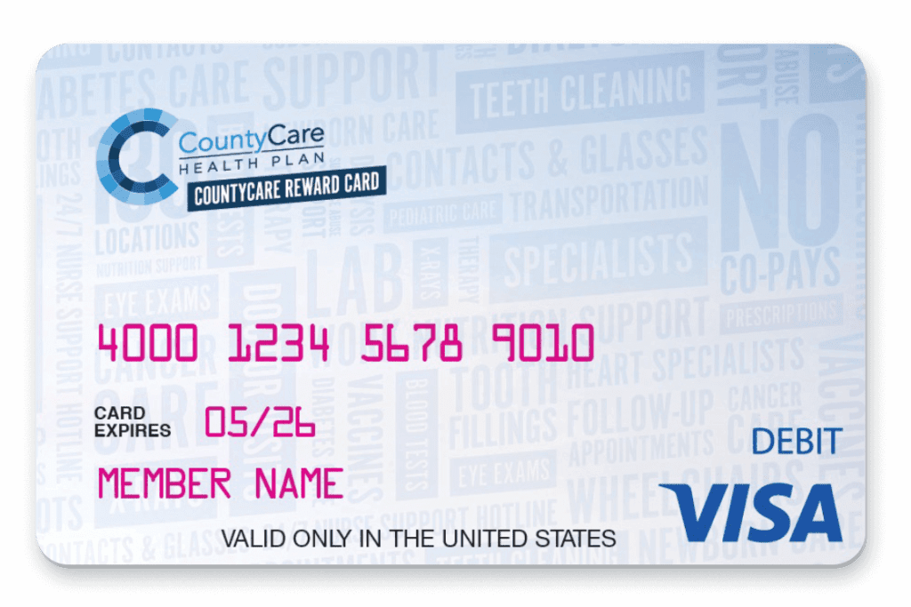 Image of a CountyCare Health Plan reward card from a Medicaid health insurance agency. The card displays a Visa logo, card number, expiration date (05/26), and Member Name placeholder. Background features health-related words like support, teeth cleaning, and eye exams. Valid in the U.S. only.